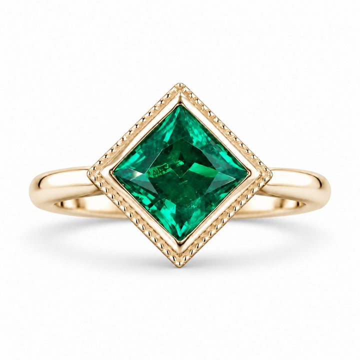 The Compass — Milgrain Bezel Emerald Ring in 14K yellow gold, front view