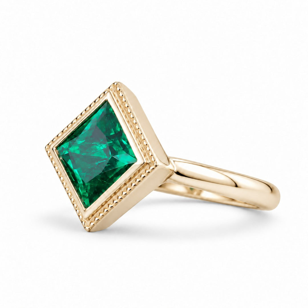 The Compass — Milgrain Bezel Emerald Ring in 14K yellow gold, three-quarter view