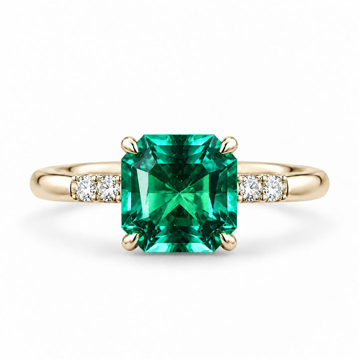 The Calibre — Emerald Accent Ring in 14K yellow gold, front view