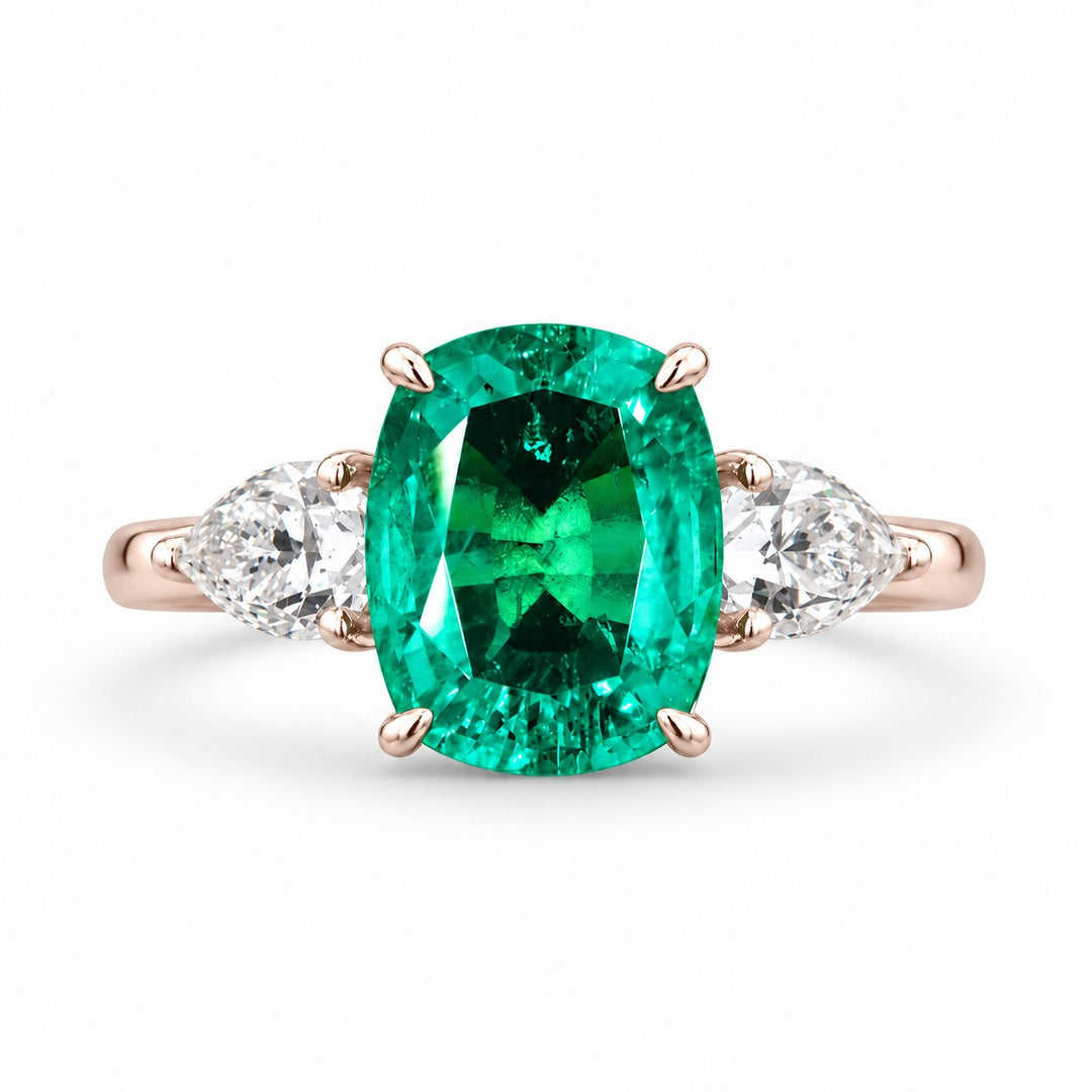 The Elysian — Cushion Three-Stone Emerald Ring in 14K rose gold, front view