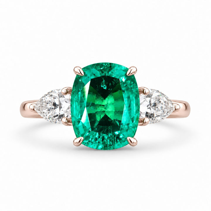 The Elysian — Cushion Three-Stone Emerald Ring in 14K rose gold, front view
