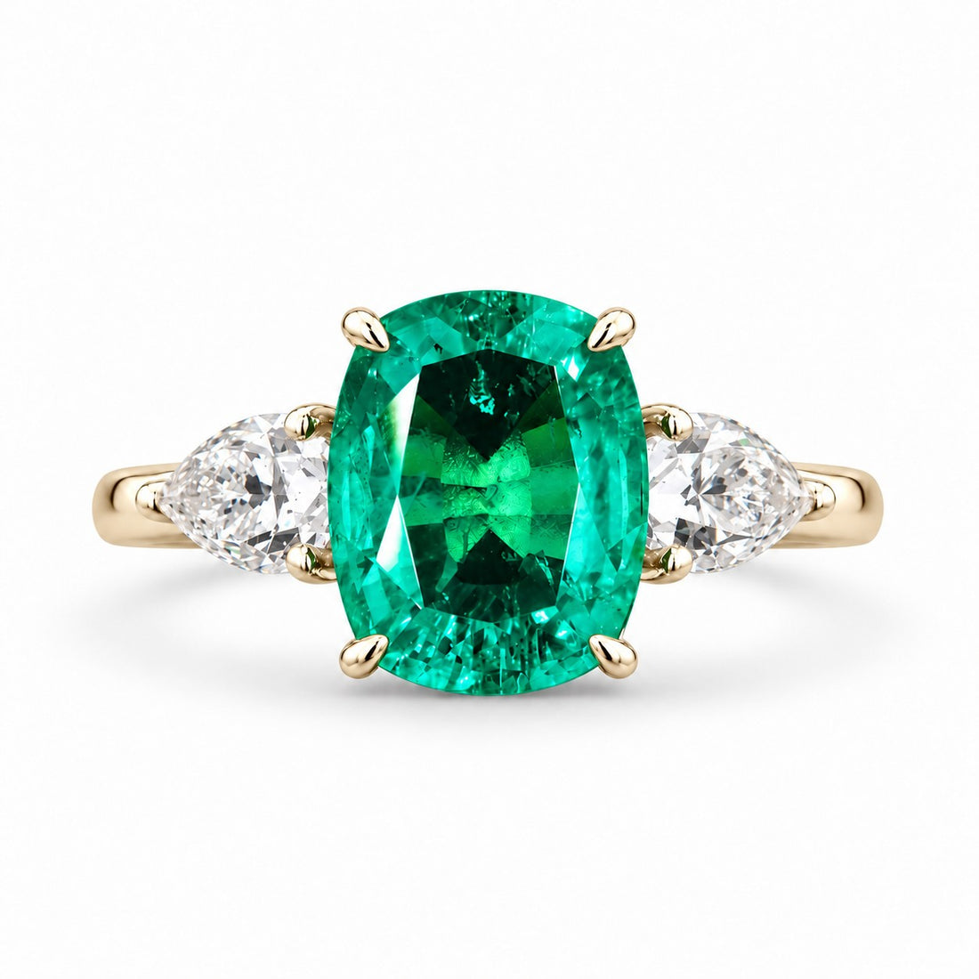 The Elysian — Cushion Three-Stone Emerald Ring in 14K yellow gold, front view