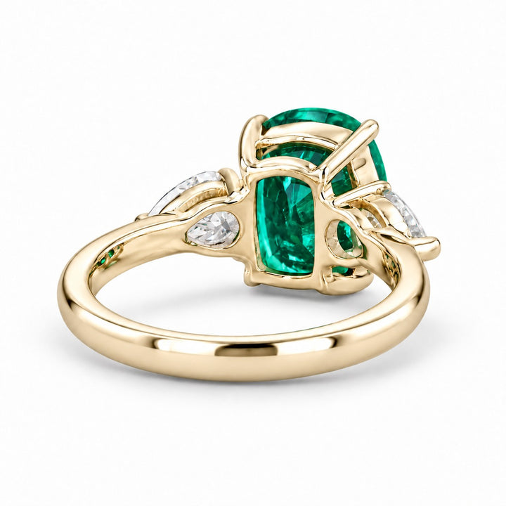 The Elysian — Cushion Three-Stone Emerald Ring in 14K yellow gold, back and setting