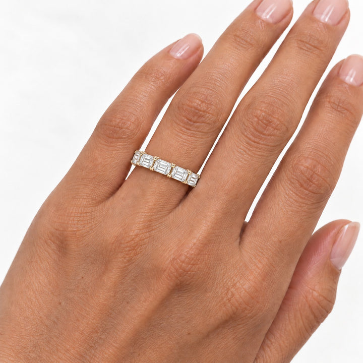Emerald-cut lab-grown diamond eternity band, 4x3mm, 14K yellow gold, on the hand