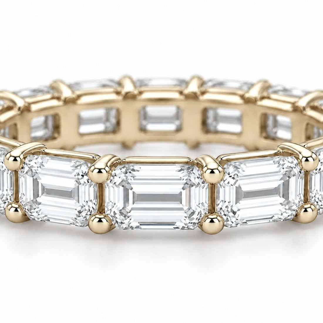 Emerald-cut lab-grown diamond eternity band, 5x3.5mm, 14K yellow gold, close-up of the stones