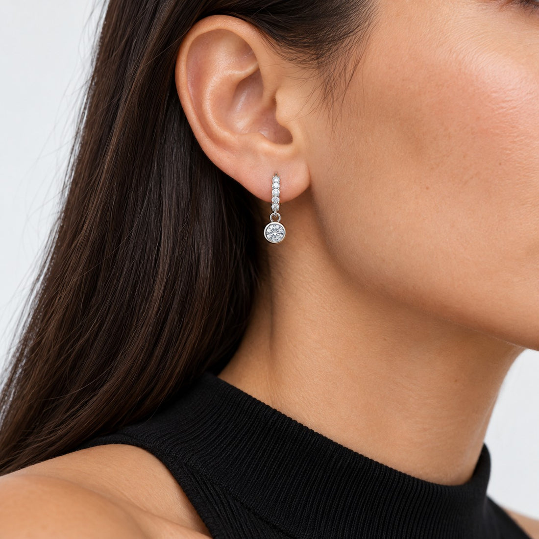 Bezel Drop Lab Diamond Huggie Earrings worn on the ear in 14K White Gold