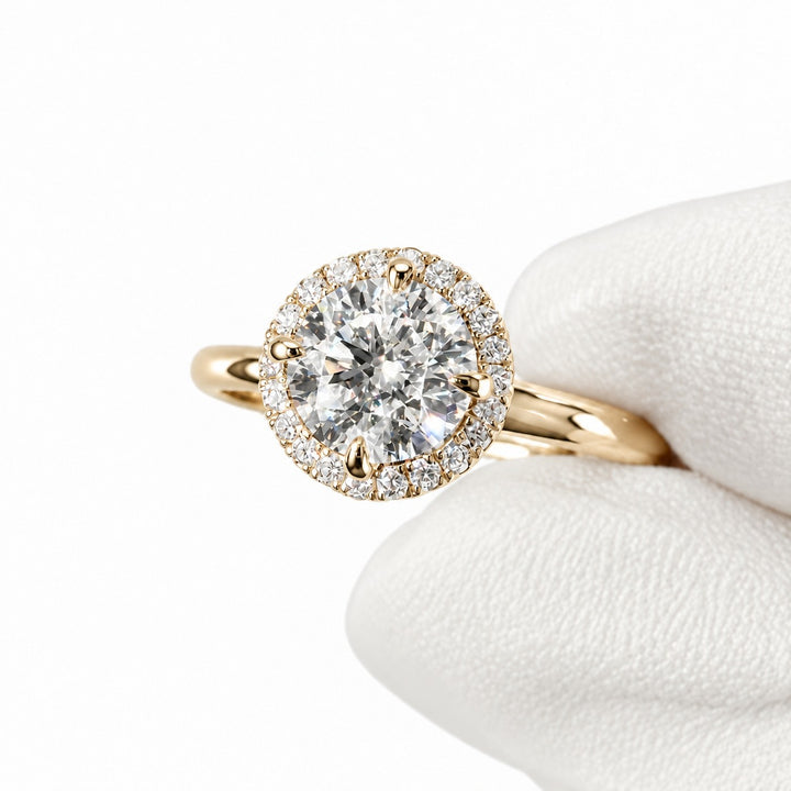 The Floating Halo in 14K yellow gold, close-up in hand