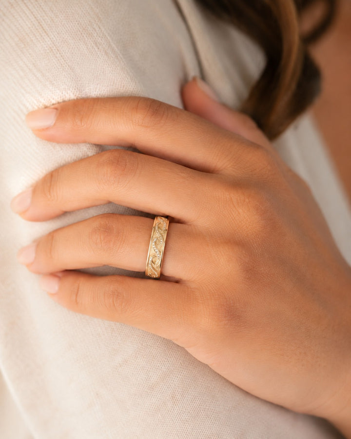 The Ocean Wave Vintage — 4mm Hand-Carved Diamond Wedding Band in yellow gold, wearing