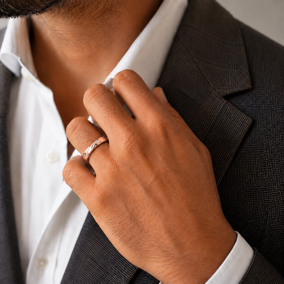 The Chevron Twist — 3mm Solid Gold Wedding Band in rose gold, wearing