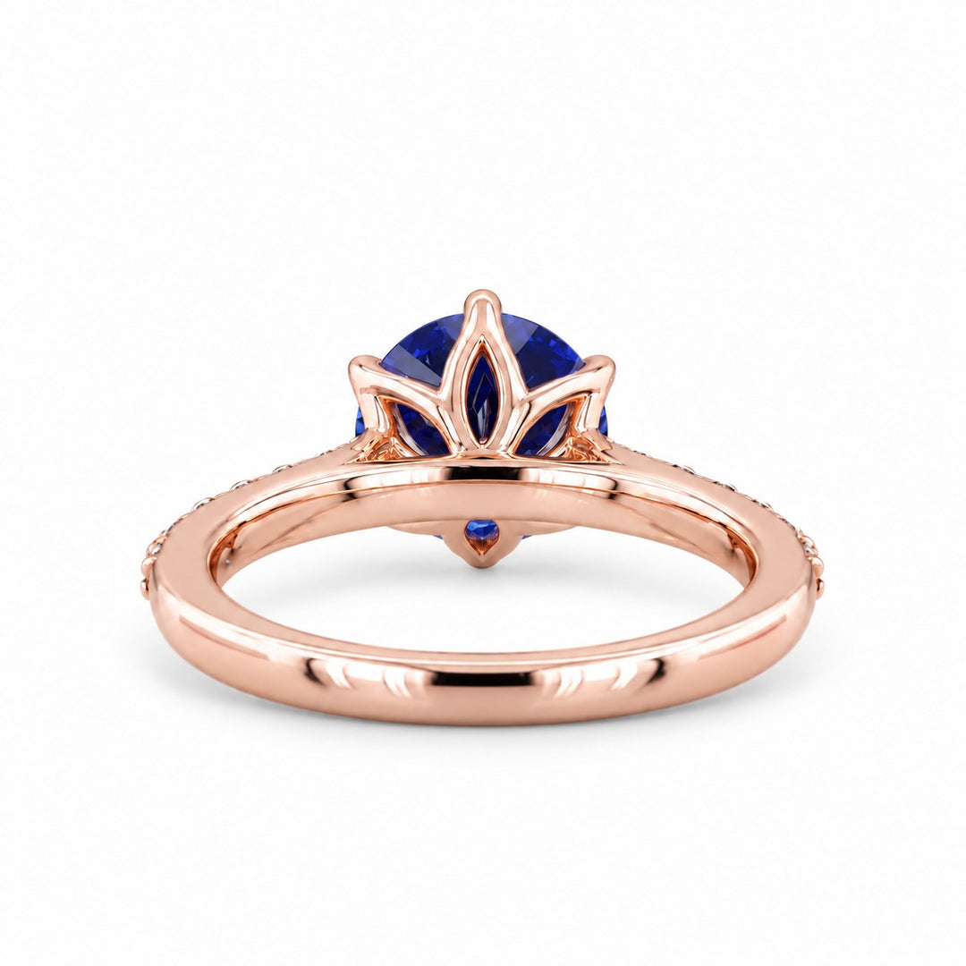 The Bluebell — Blue Round Sapphire with Floral Prongs & Diamond Half-Eternity Ring in rose gold, profile view