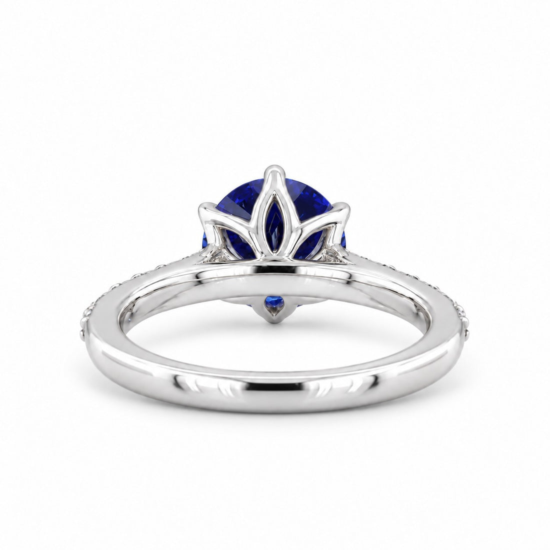 The Bluebell — Blue Round Sapphire with Floral Prongs & Diamond Half-Eternity Ring in white gold, profile view