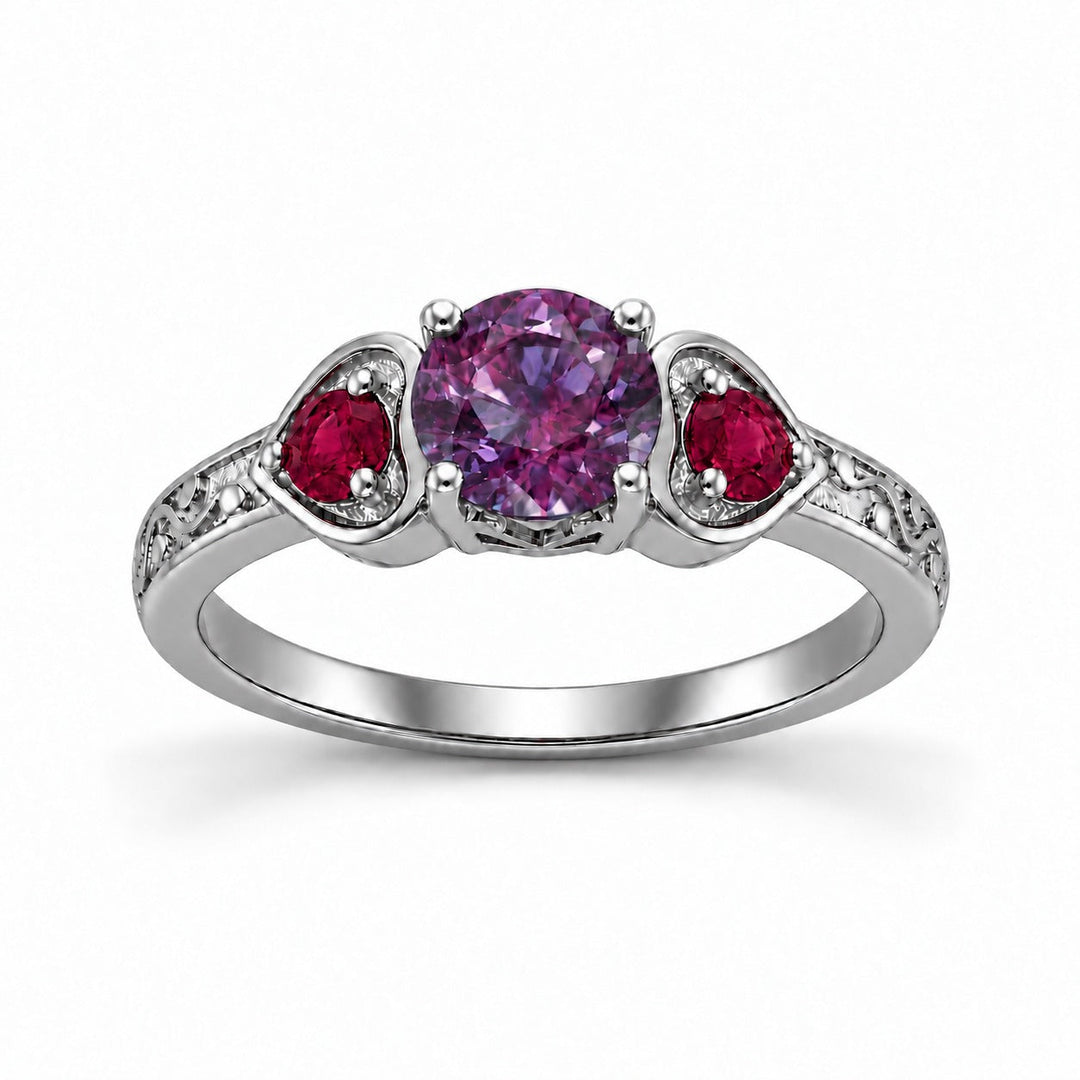 The Roserie — Alexandrite & Ruby Three-Stone Ring in platinum, in warm light
