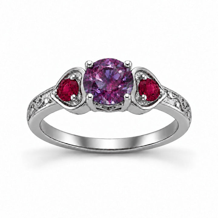 The Roserie — Alexandrite & Ruby Three-Stone Ring in platinum, in warm light