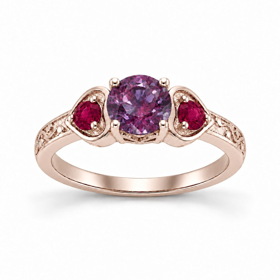 The Roserie — Alexandrite & Ruby Three-Stone Ring in 14K rose gold, in warm light