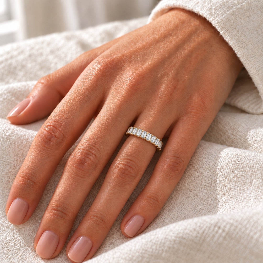 1.50ctw Emerald Diamond Half-Eternity Band (2.5mm) in yellow gold, on the hand