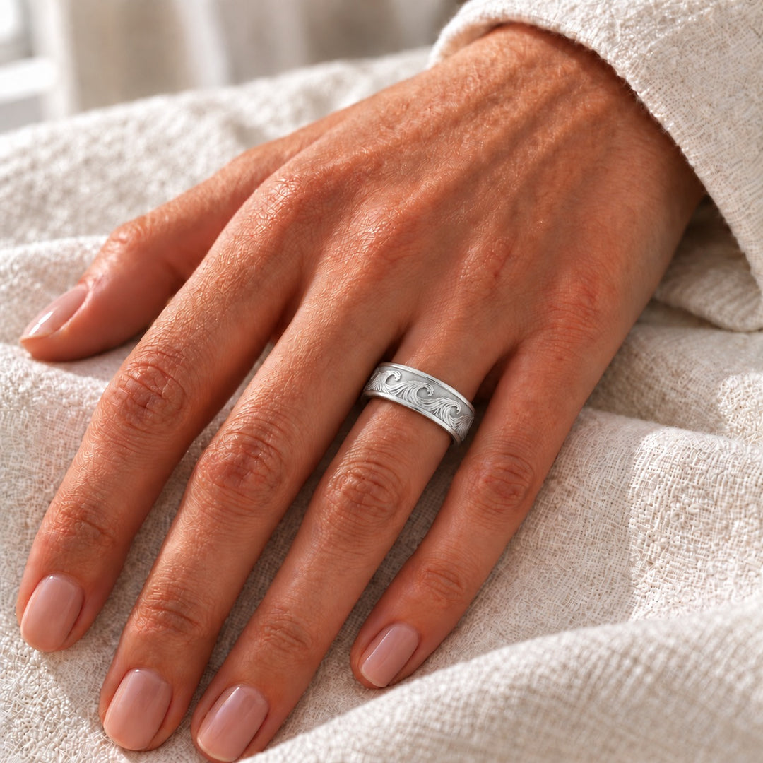 The Ocean Wave Vintage — 7mm Hand-Carved Solid Gold Wedding Band in white gold, on the hand