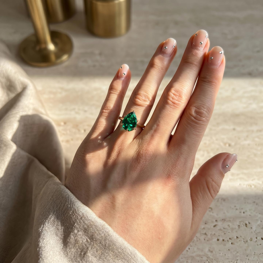 The Lotus Lace — Pear Emerald Ring (Petal Setting)
