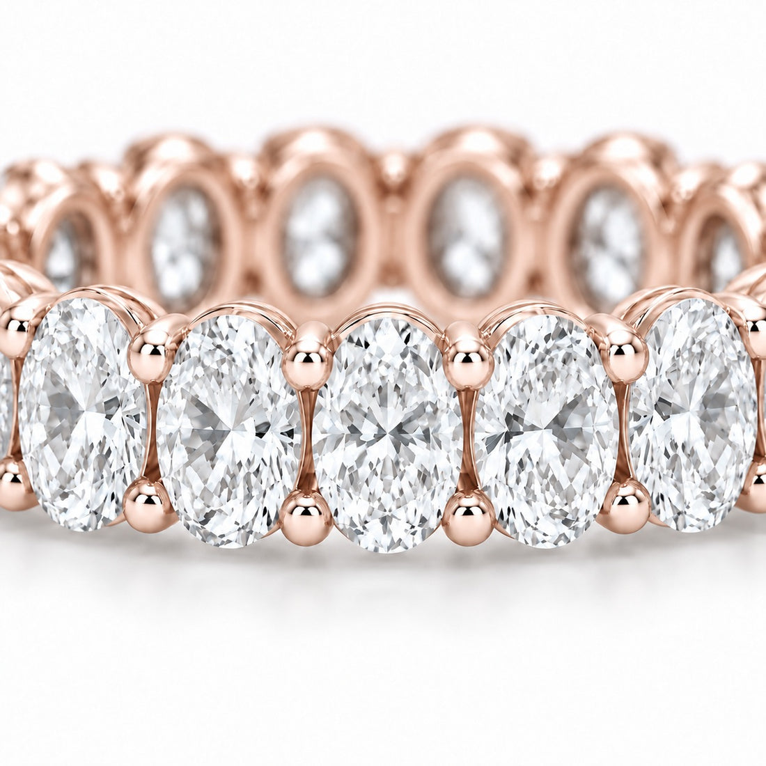 Oval lab-grown diamond eternity band, 4x3mm, 14K rose gold, macro of the stones
