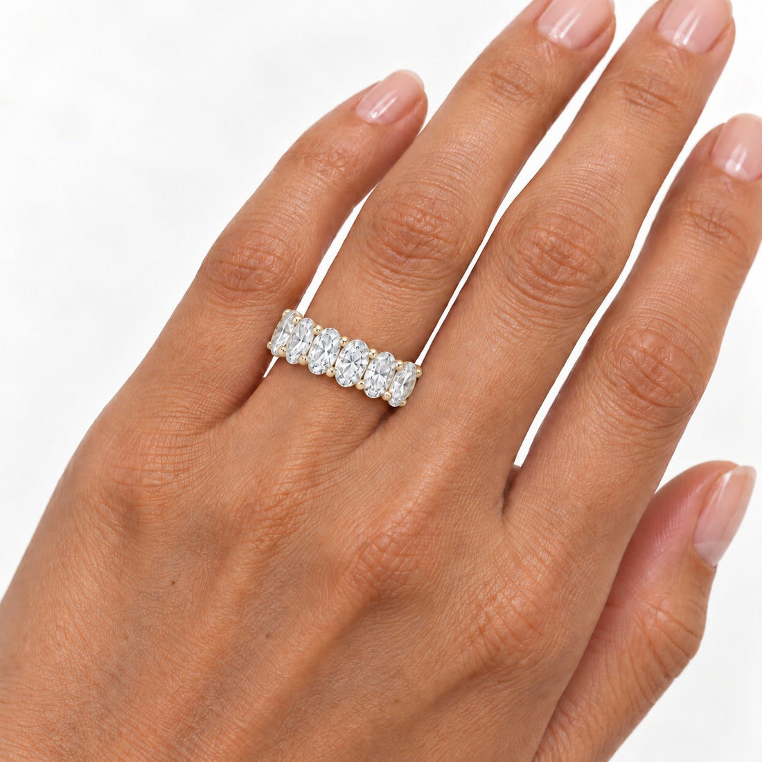Oval lab-grown diamond eternity band, 5x3.5mm, 14K yellow gold, on the hand