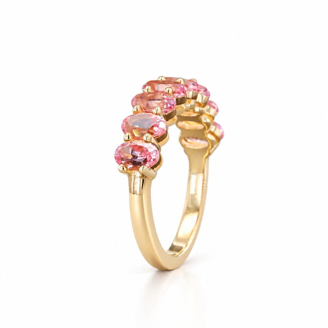 Oval Sakura Pink Sapphire Half Eternity Band in 14K yellow gold, angle view