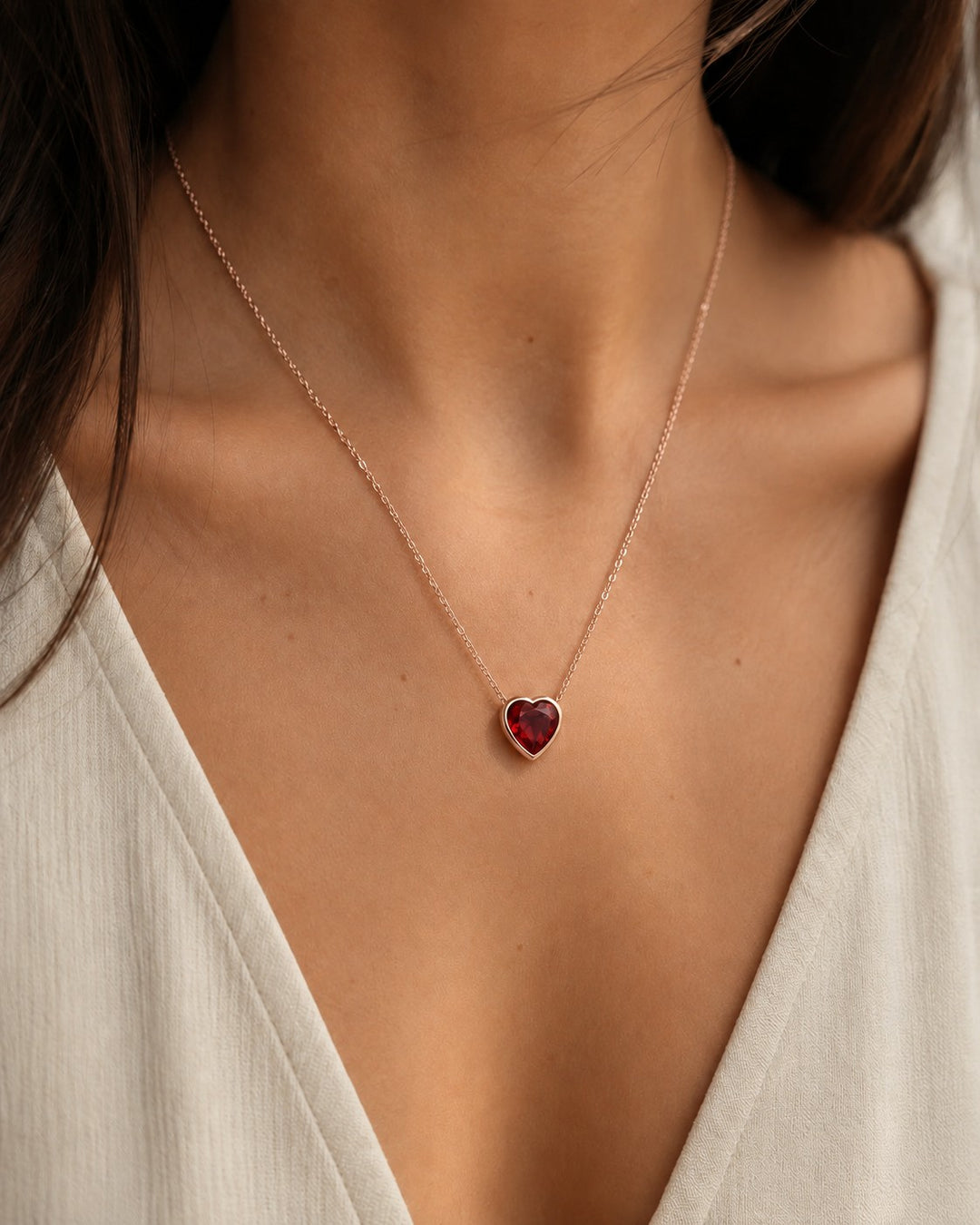 Bezel-Set Heart Lab Ruby Pendant — 2.50ct worn on model in 14K Rose Gold
