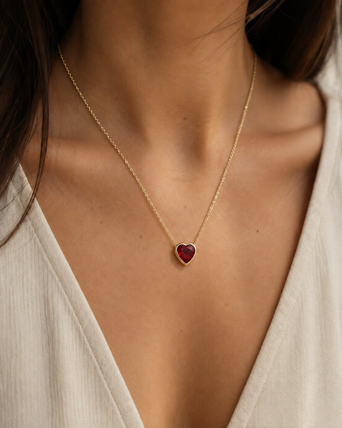 Bezel-Set Heart Lab Ruby Pendant — 2.50ct worn on model in 14K Yellow Gold