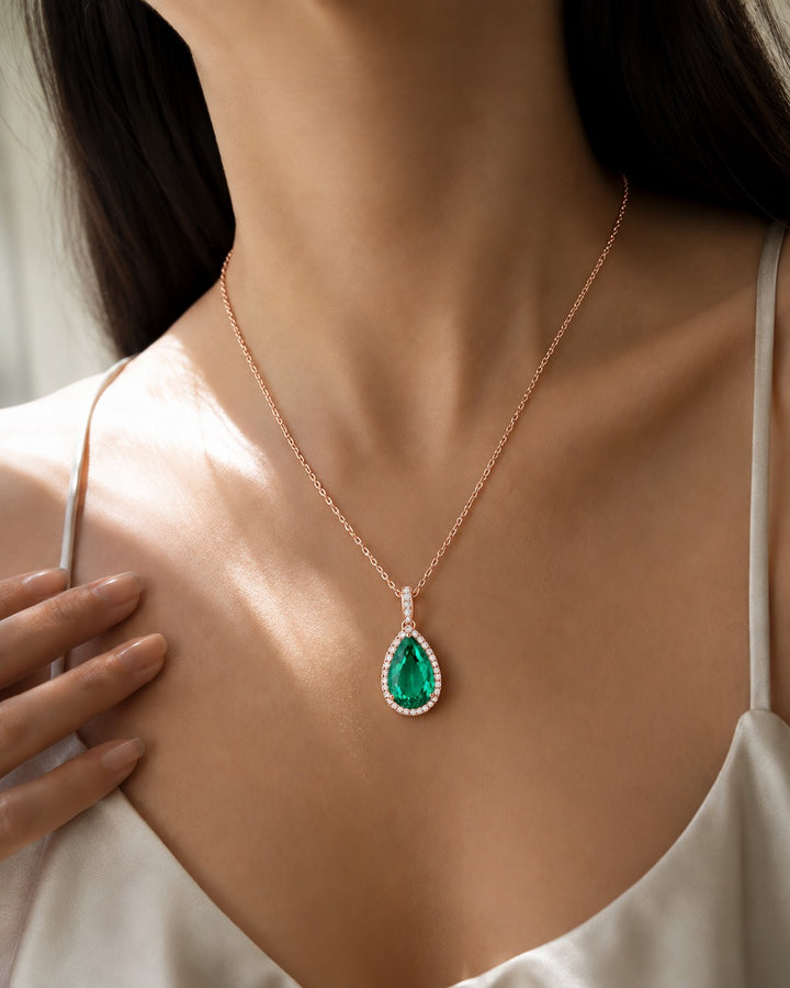 Pear Lab Emerald Halo Pendant — 9.50ct worn on model in 14K Rose Gold