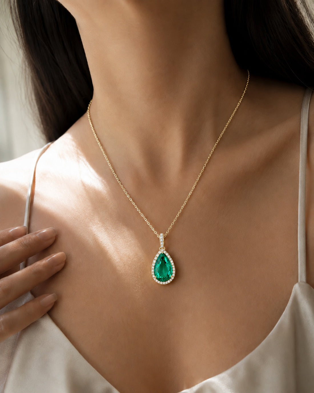 Pear Lab Emerald Halo Pendant — 9.50ct worn on model in 14K Yellow Gold