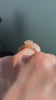 The Sovereign Crest in 14K yellow gold — underside, worn face-on [ld m=y shot=under]