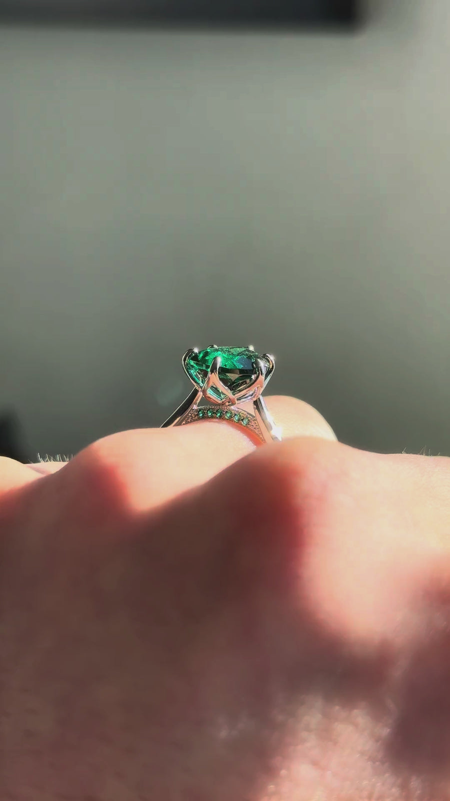 The Lotus Lace pear emerald in 14K white gold / platinum — underside, worn face-on [ld m=w shot=under]