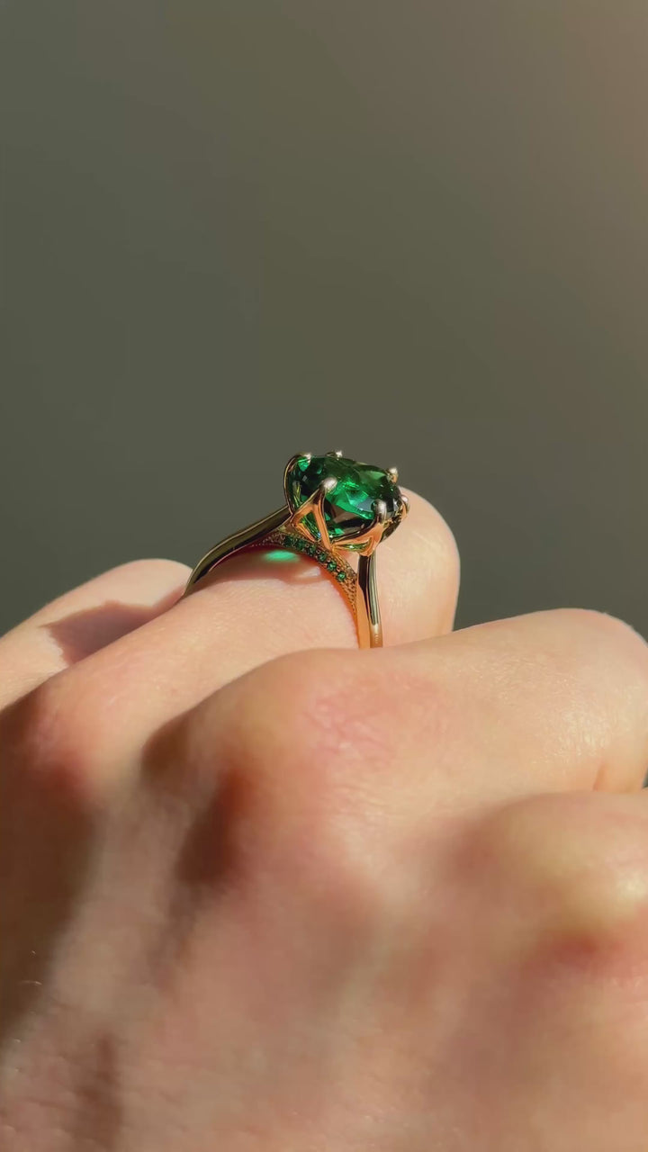 The Lotus Lace pear emerald in 14K yellow gold — underside, worn face-on [ld m=y shot=under]