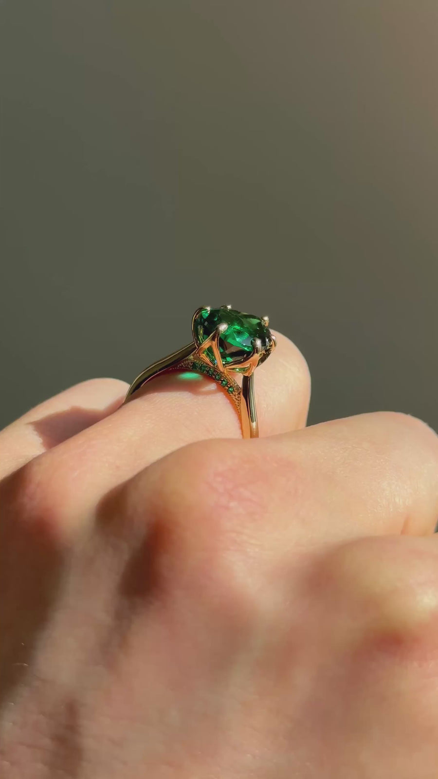 The Lotus Lace pear emerald in 14K yellow gold — underside, worn face-on [ld m=y shot=under]