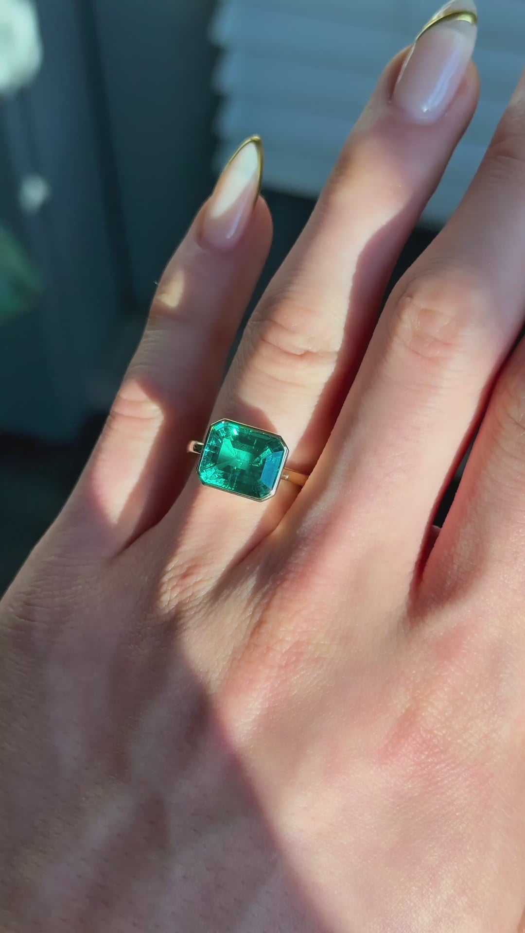 The Axis East-West emerald in 14K yellow gold — worn on the hand (indoor light) [ld m=y shot=wear]