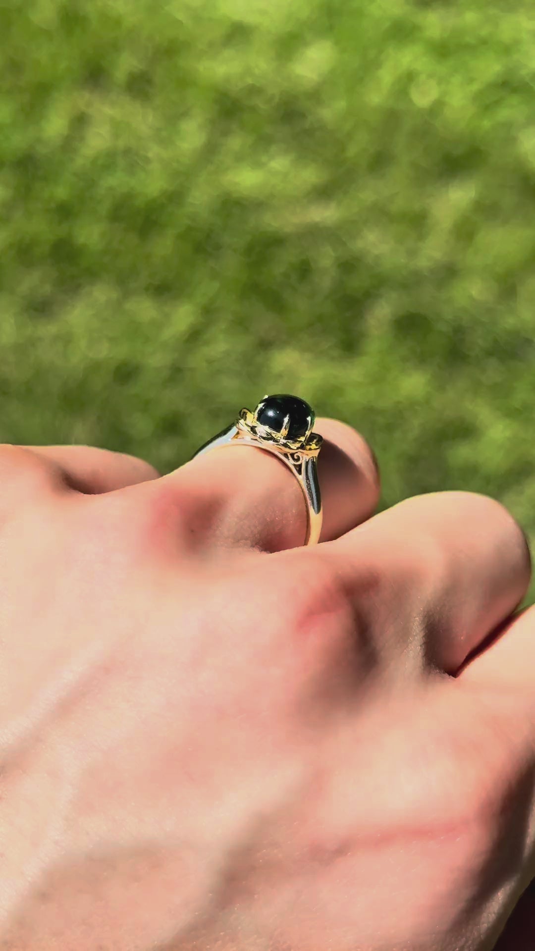 The Bloom cabochon emerald in 14K yellow gold — underside, worn face-on [ld m=y shot=under]