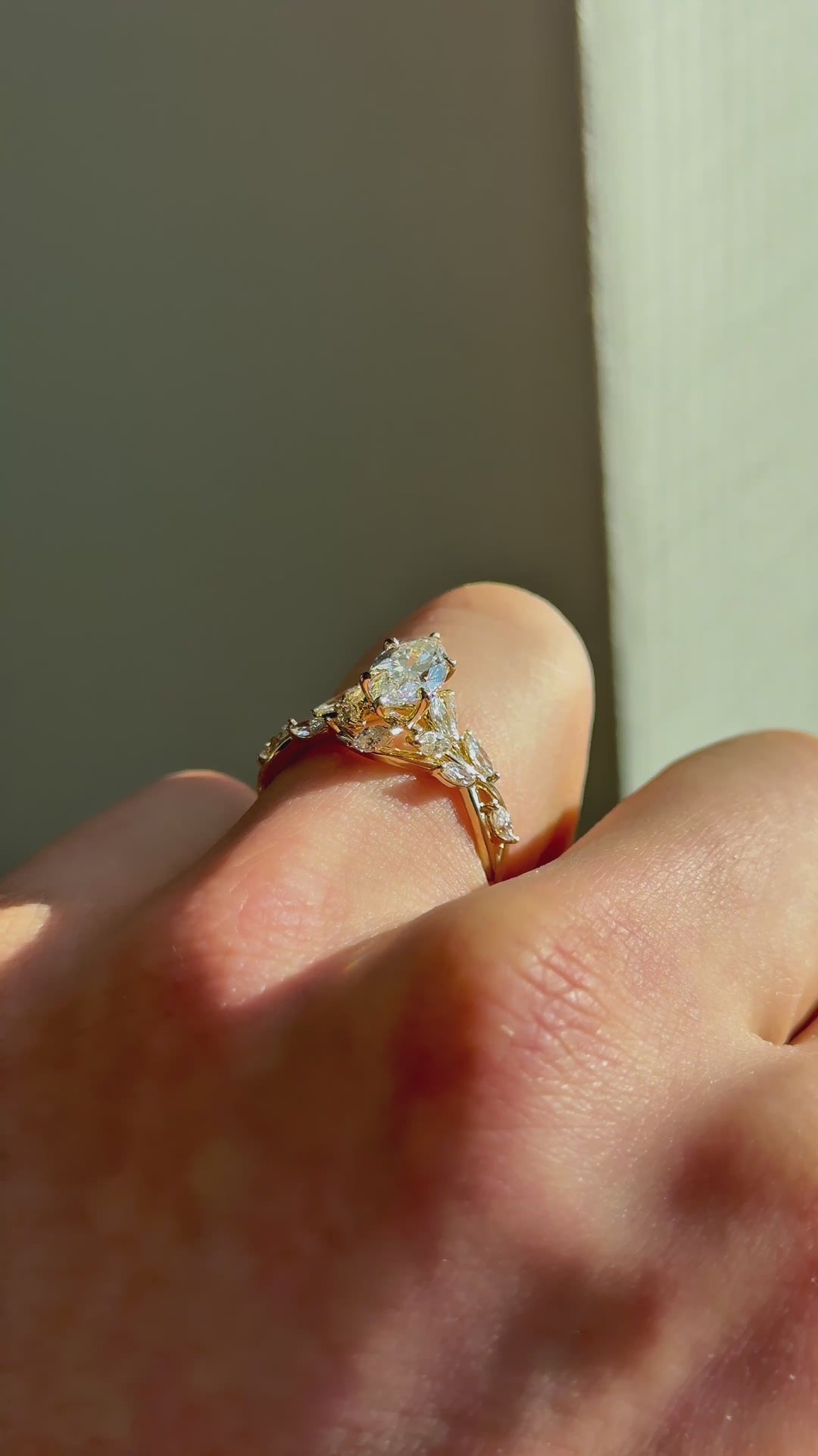 The Magnolia with a marquise center in 14K yellow gold — underside, worn face-on [ld m=y shot=under]