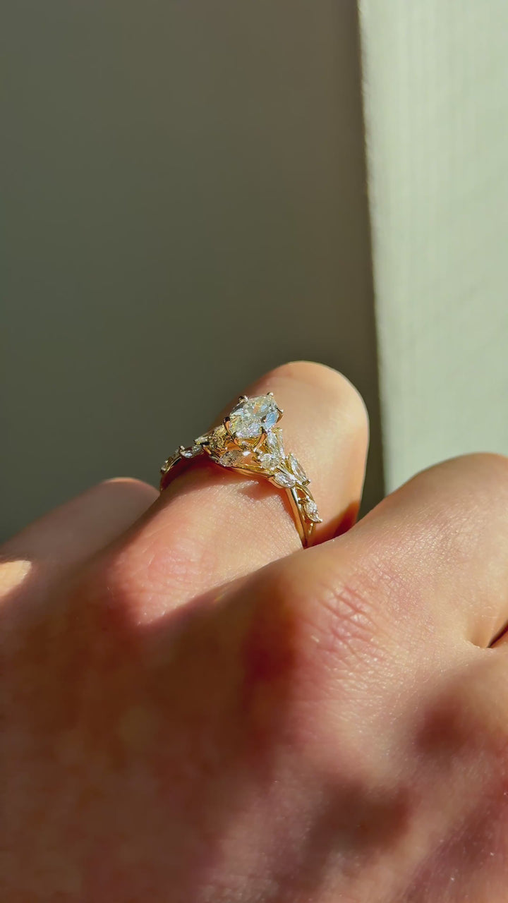 The Magnolia with a marquise center in 14K yellow gold — underside, worn face-on [ld m=y shot=under]