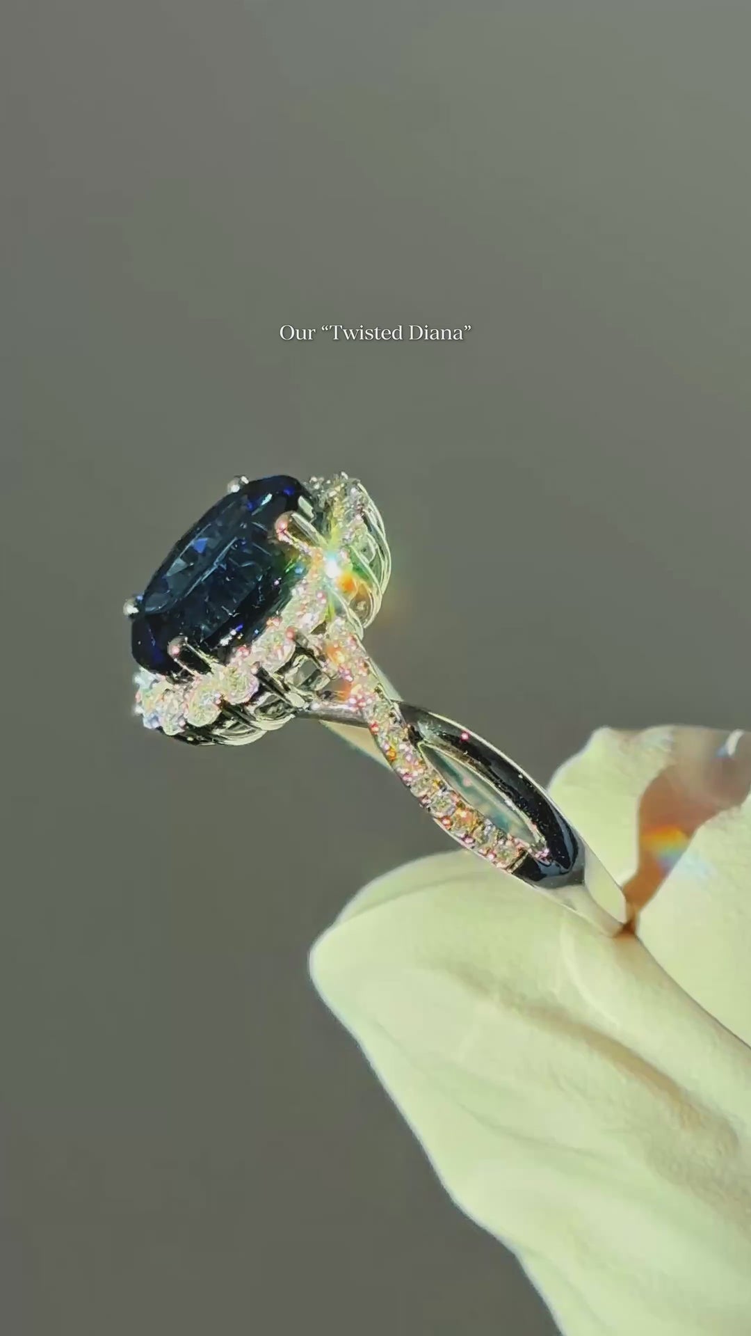 The Twisted Diana — Diamond Halo/Twist Band Oval Blue Sapphire Ring