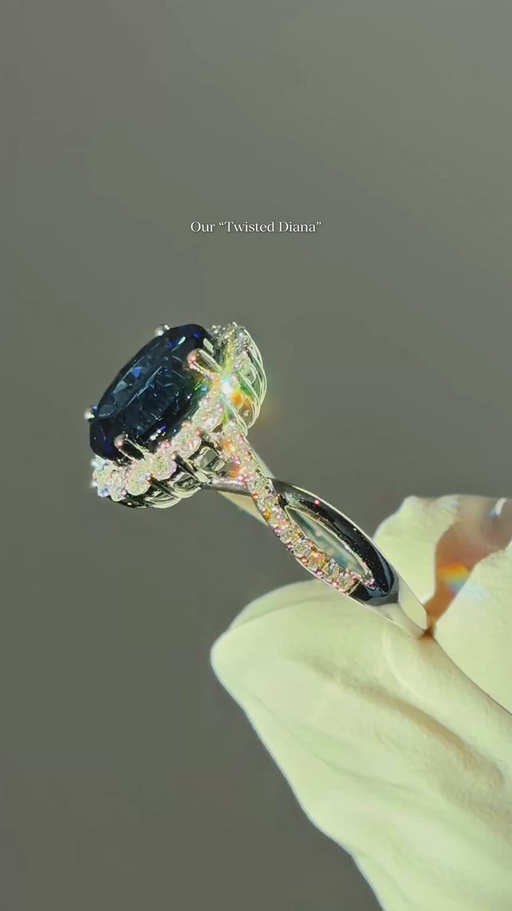 The Twisted Diana — Diamond Halo/Twist Band Oval Blue Sapphire Ring
