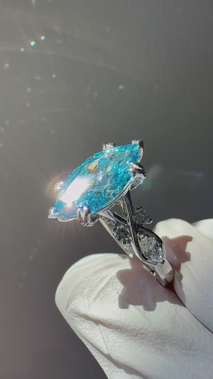 The Sovereign Crest blue diamond in 14K white gold — close-up detail [ld m=w shot=close]