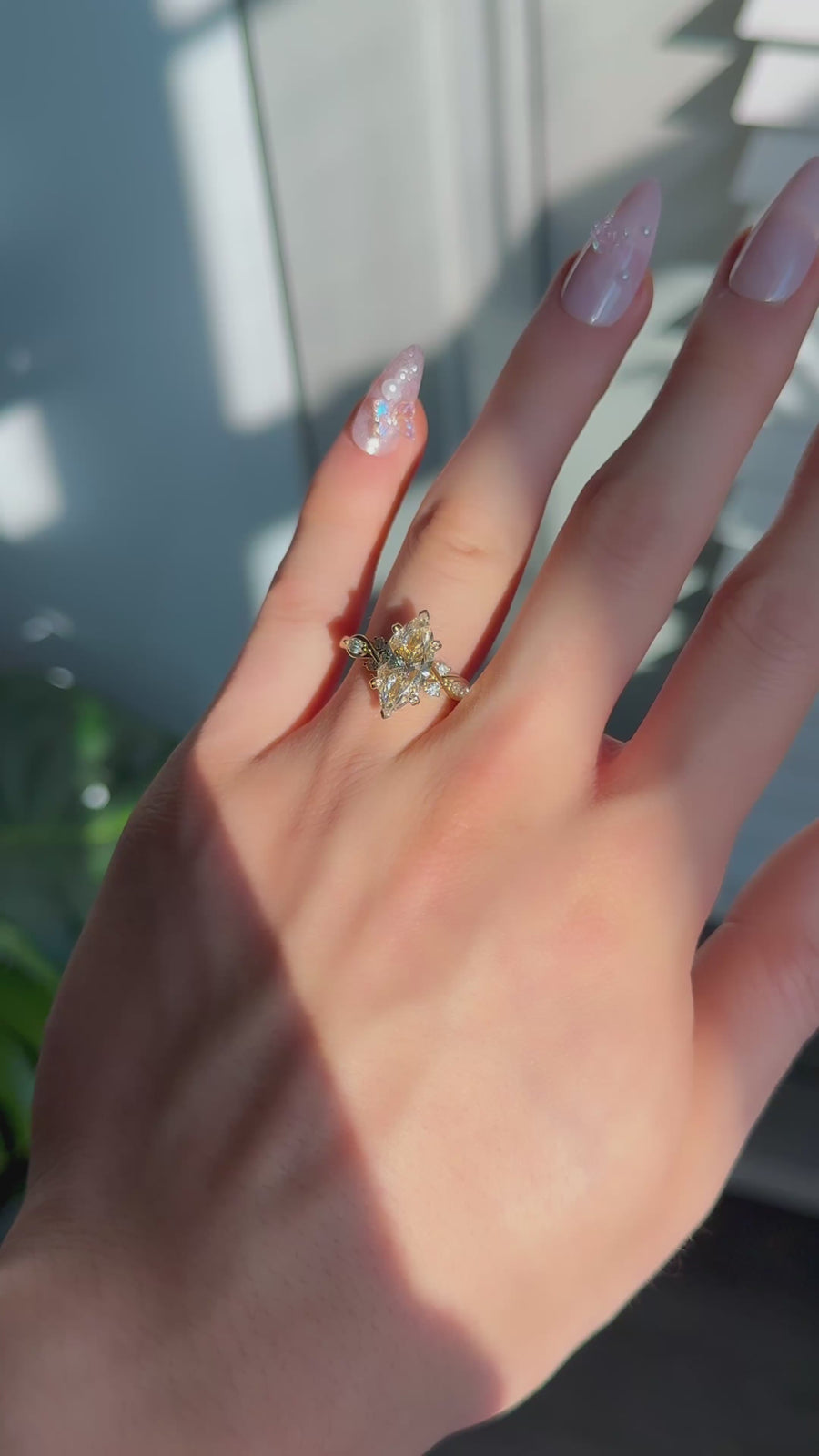 The Sovereign Crest in 14K yellow gold — worn on the hand (far to close) [ld m=y shot=wear]