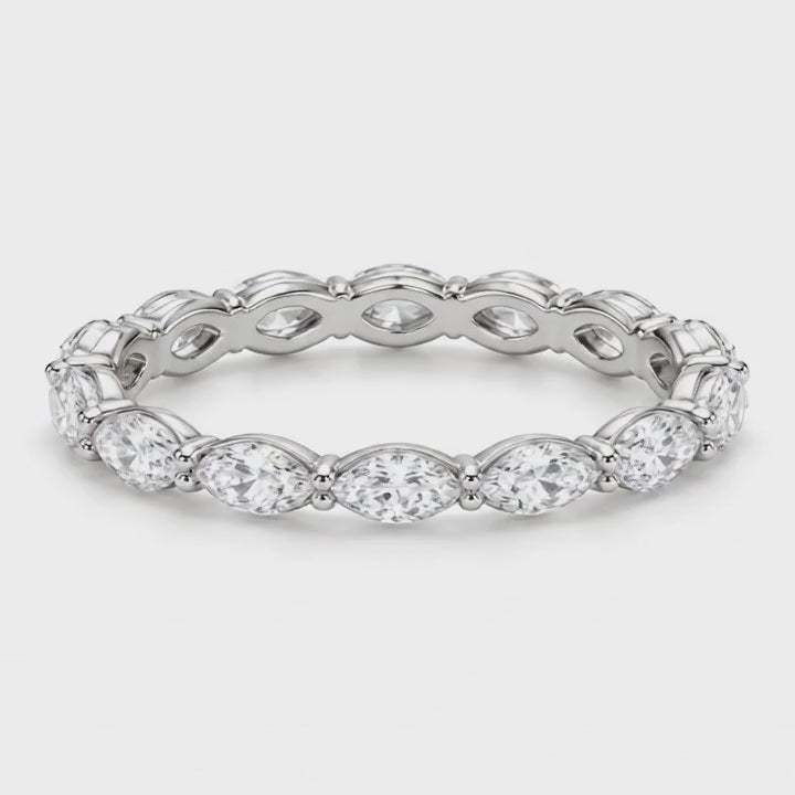 Marquise lab-grown diamond eternity band in white gold turning on a white background