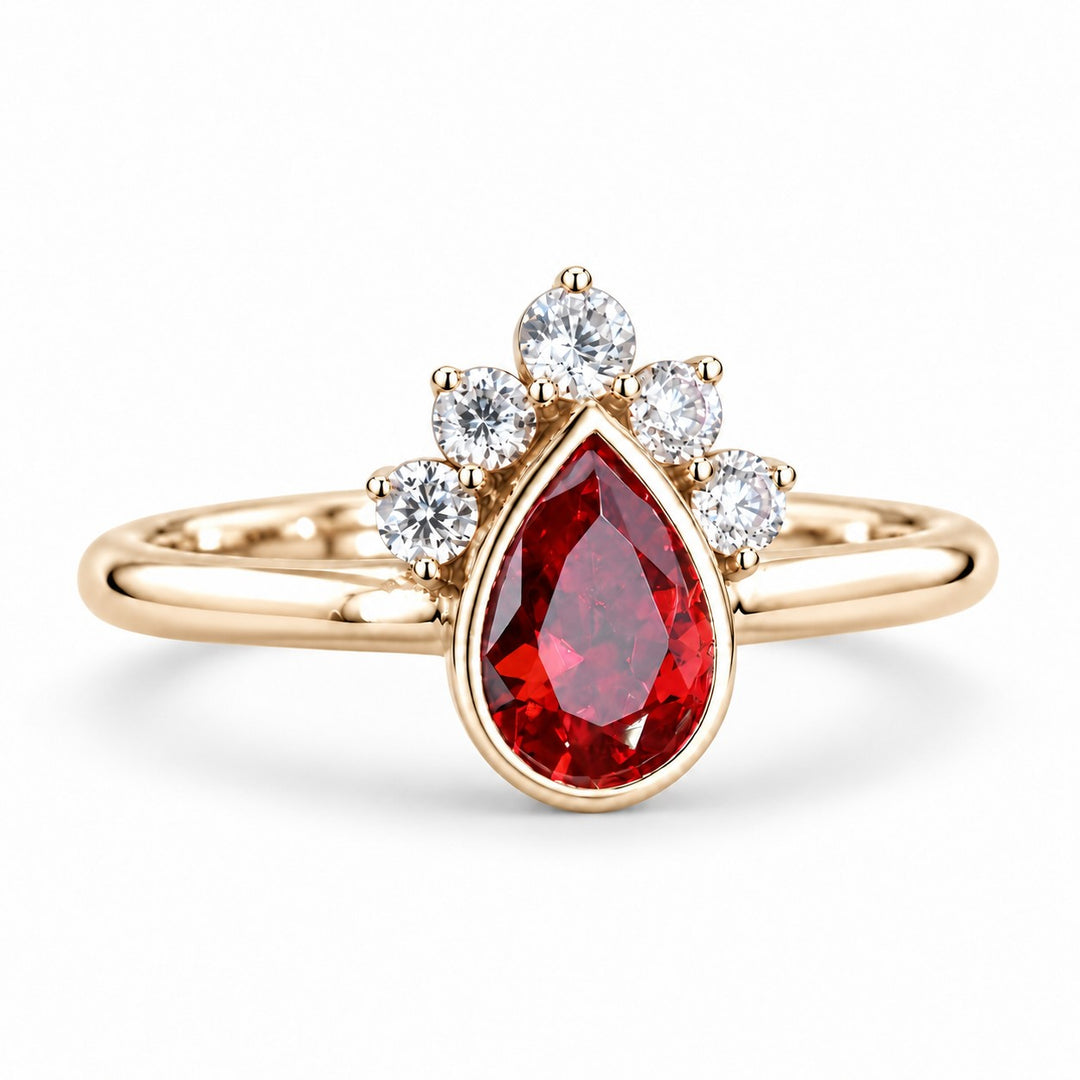 The Devotion — Pear Ruby Ring in 14K yellow gold, three-quarter view