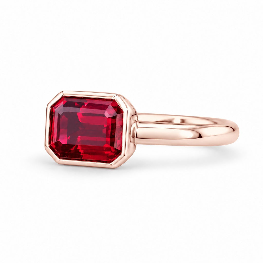 The Axis — East–West Bezel-Set Ruby Ring in 14K rose gold, three-quarter view