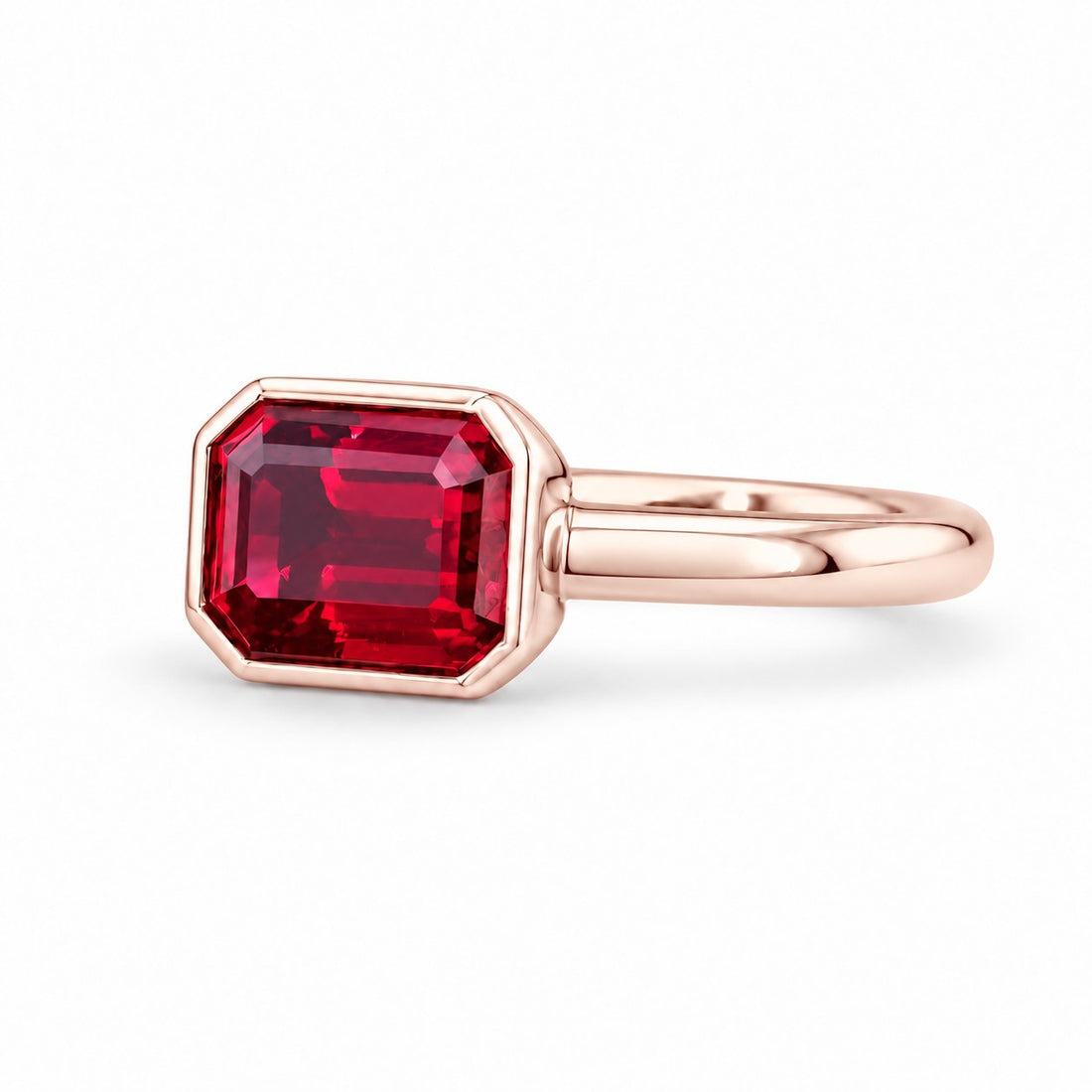 The Axis — East–West Bezel-Set Ruby Ring in 14K rose gold, three-quarter view