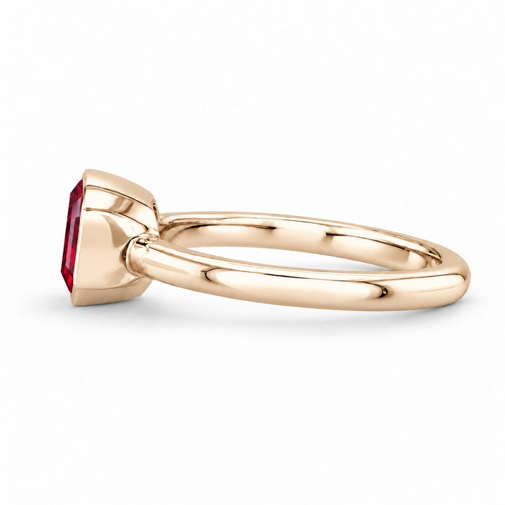 The Axis — East–West Bezel-Set Ruby Ring in 14K yellow gold, side view