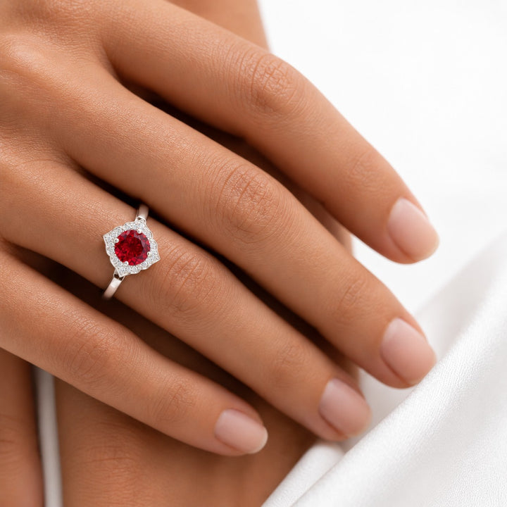 The Valencia — Vintage Diamond Halo Ruby Ring in 14K white gold, on the hand