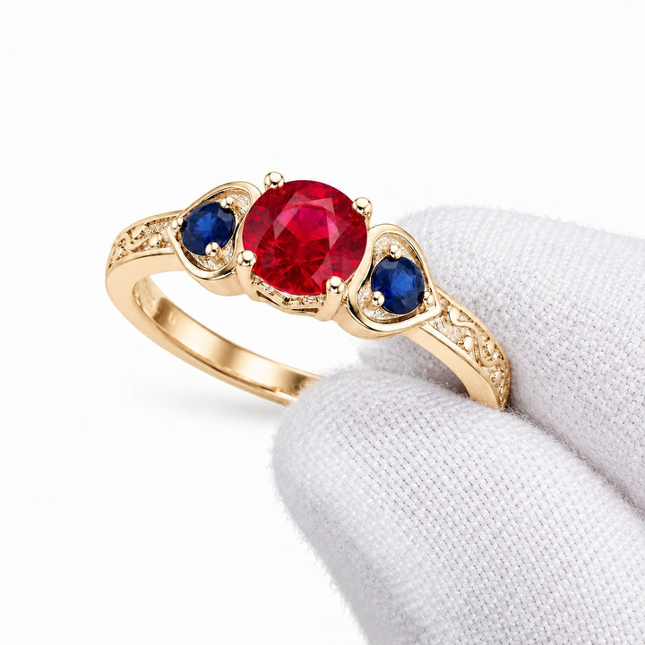 "Ruby & Sapphire" Three-Stone Ring in yellow gold, three-quarter view