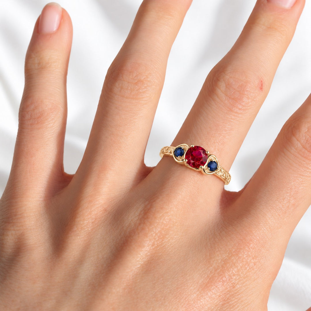 "Ruby & Sapphire" Three-Stone Ring in yellow gold, on the hand