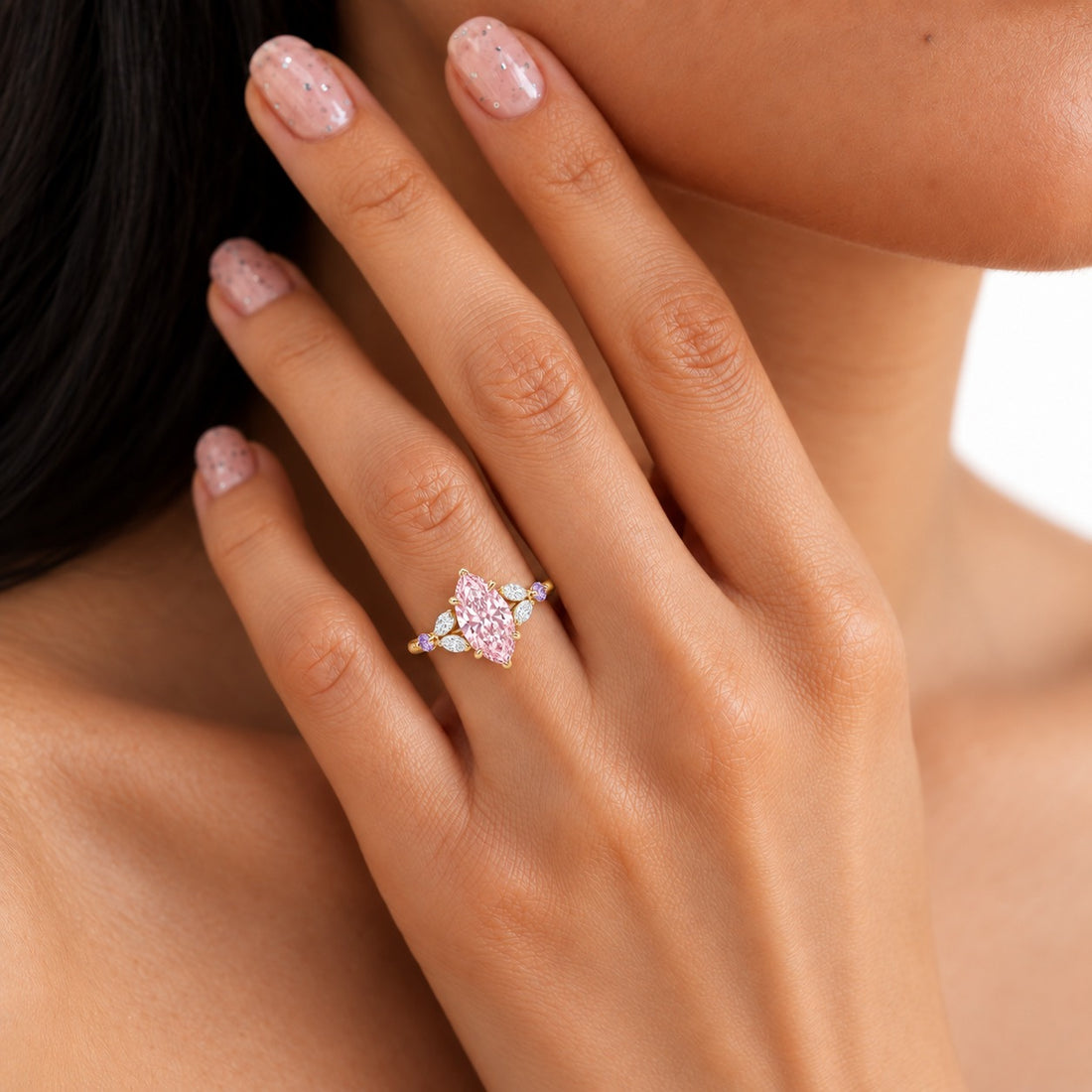The Rapunzel with a pink lab-grown marquise diamond and amethyst accents in 14K yellow gold, on the hand
