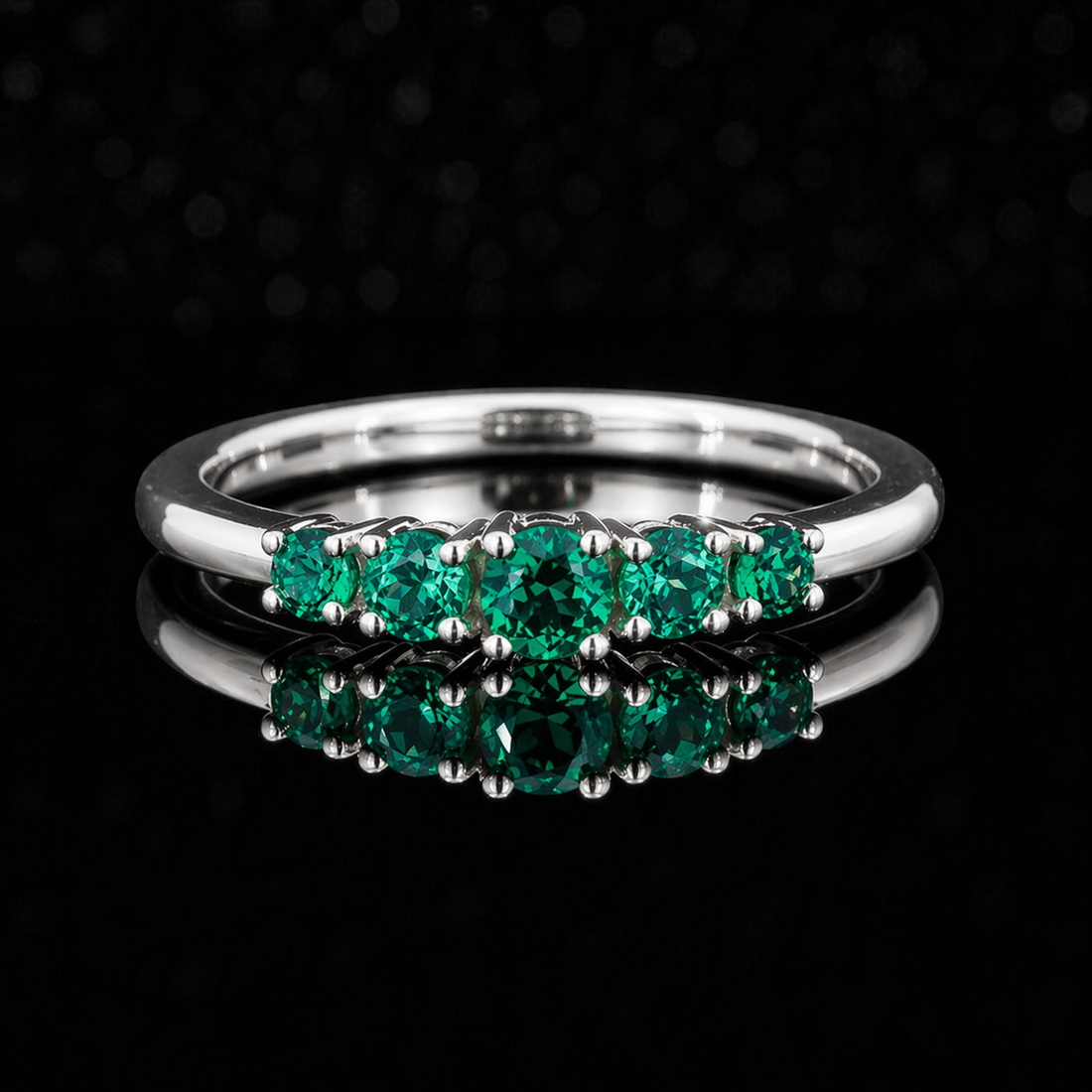 Round lab emerald five-stone ring in 14K white gold